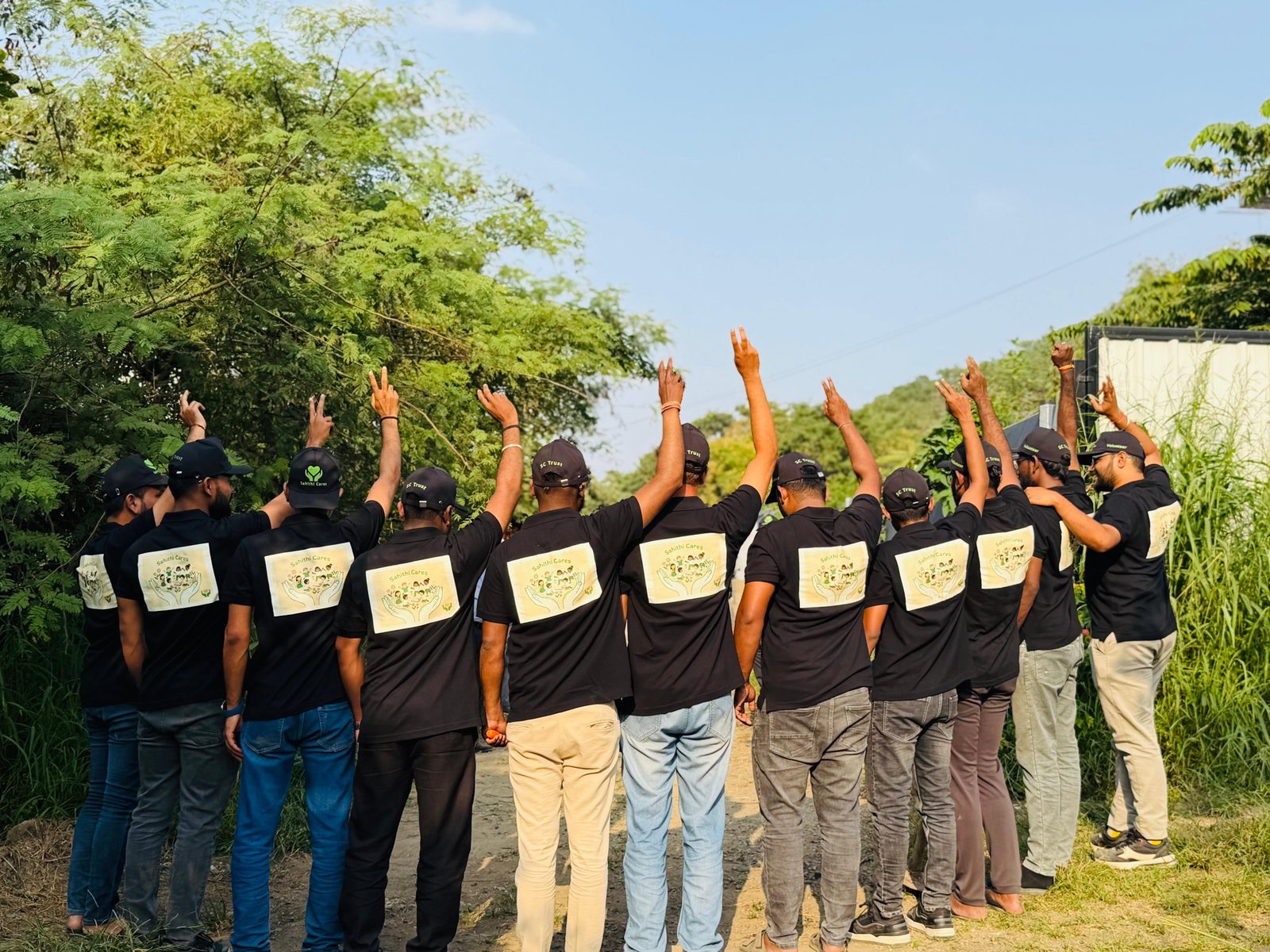 Sahithi Cares volunteers celebrating together after a plantation drive